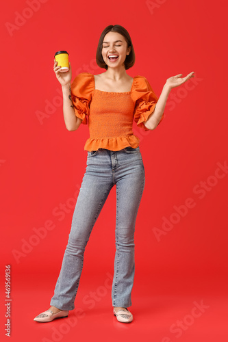 Beautiful woman with cup of...