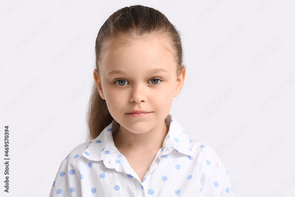 Portrait of pretty little girl on light background Portrait of pretty little girl on light background