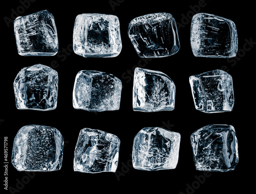 Natural, textured ice cubes with frozen air bubbles on black background.