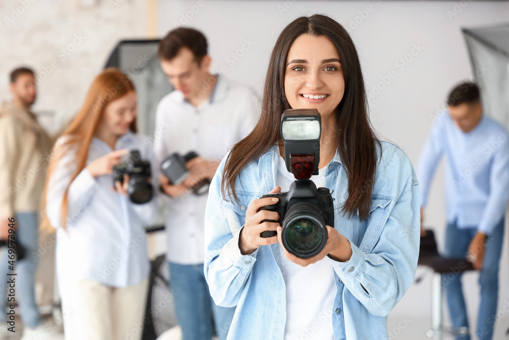 Female photographer during classes in studio