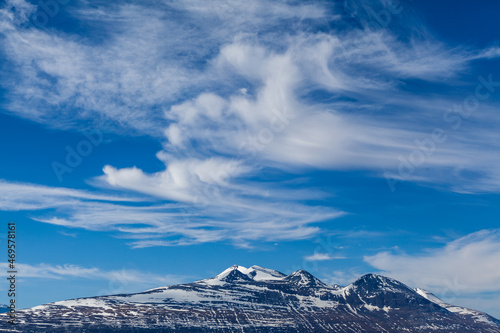 Cloudscape with cirrus clouds over the mountain range Akka  Stora Sj  fallet National Park  Lapland  Sweden 