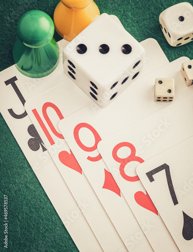 Canvas Print Playing cards and board game figures arranged on a poker table in a casino