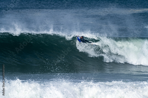 Bodyboarder surfing ocean wave