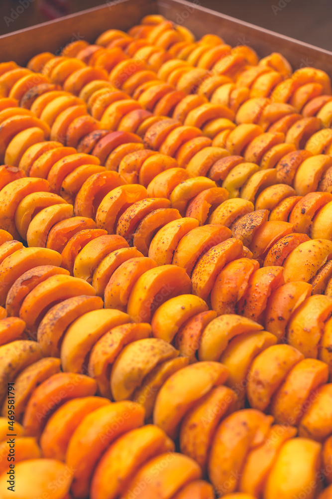 Fototapeta premium The process of home cooking dried fruits in an electric dryer.