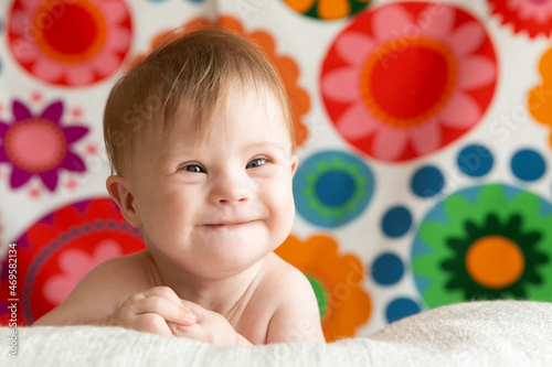 Portrait of a positive girl with Down syndrome.