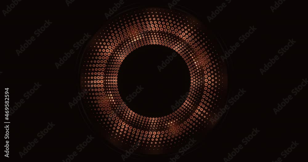 Futuristic shiny bronze circles rotating on black background.