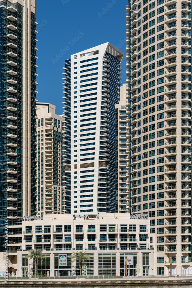 Modern High-Rises in Dubai. A close-up view of modern high-rise buildings in Dubai, reflecting the city's rapid growth and architectural innovation. Modern High-Rises in Dubai. A close-up view of modern high-rise buildings in Dubai, reflecting the city's rapid growth and architectural innovation.