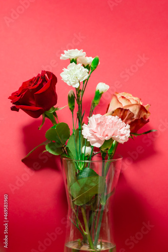 Wallpaper Mural Big red rose with white carnations bouquet close up. Red background interior. Florist shop display with copy space.  Torontodigital.ca