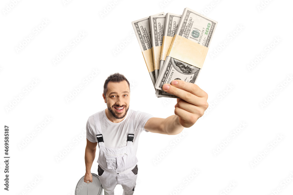 House painter holding money in front of camera House painter holding money in front of camera