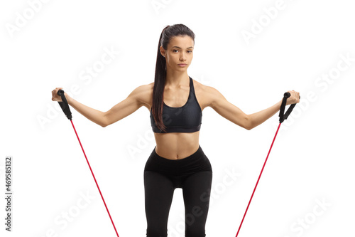 Young female exercising with a resistance band