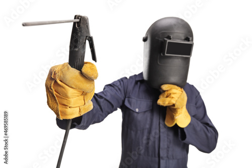 Plakat Welder with a face shield using a welding machine