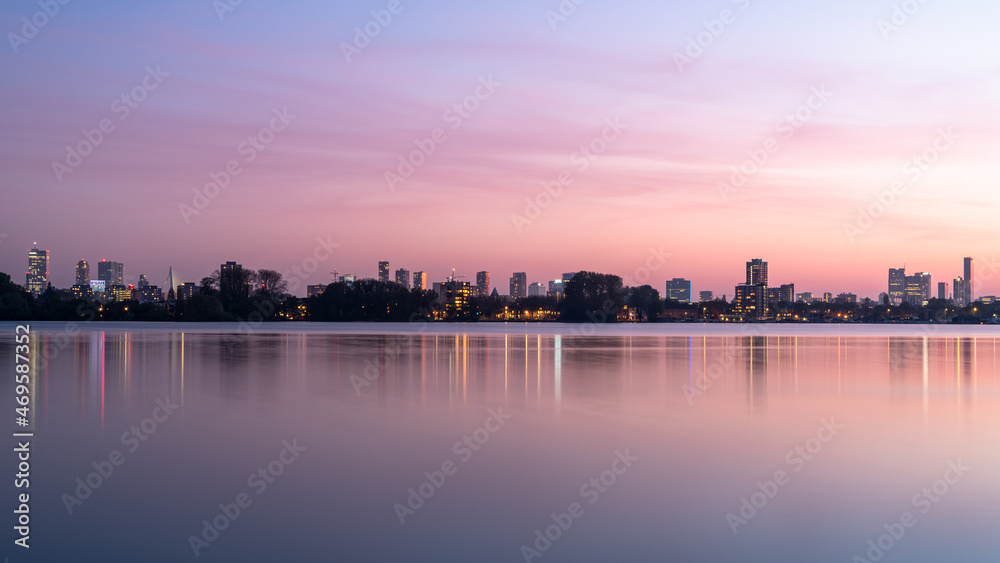 The skyline of Rotterdam during a pink sunset