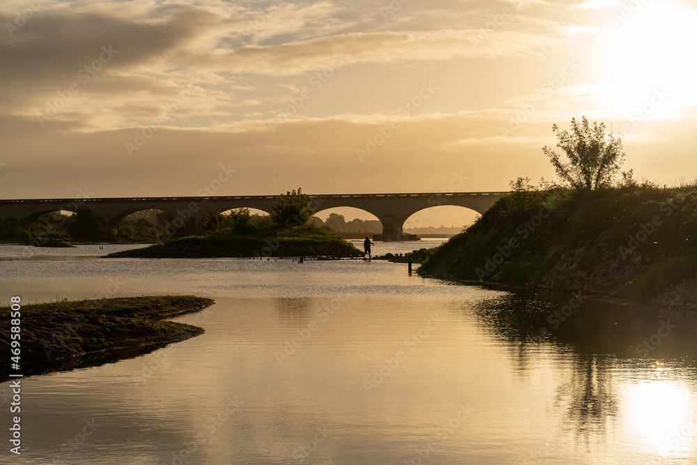 Fototapeta premium Bridge over the Loire River with sunrise