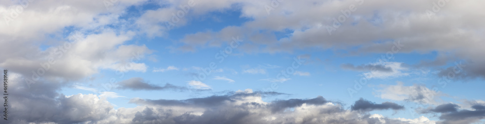 Naklejka premium Beautiful Panoramic View of Cloudscape during a colorful and sunny fall season day. Taken on the West Coast of British Columbia, Canada.