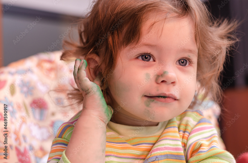 The concept of children's creativity. Dirty baby painting The concept of children's creativity. Dirty baby painting