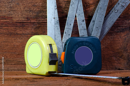 Roulette. Measure the length. Roulette on a wooden background