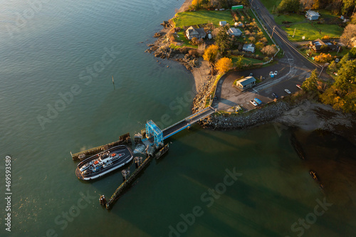 Aerial View of a Small Car Ferry Servicing Lummi Island, Washington. Transportation to and from the island requires a 21 car ferry as seen here in this aerial view.