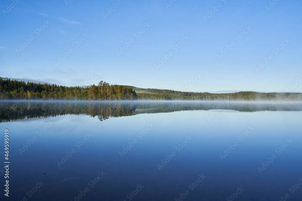 A lake in the morning mist