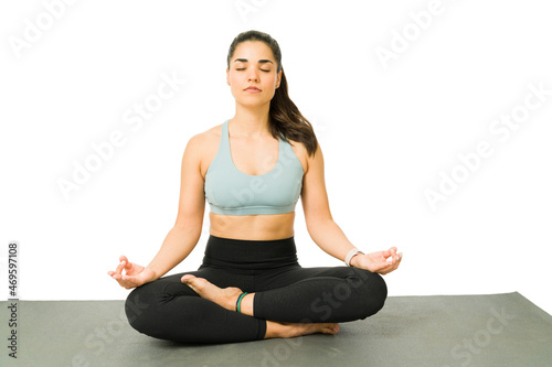 Relaxed fit woman meditating