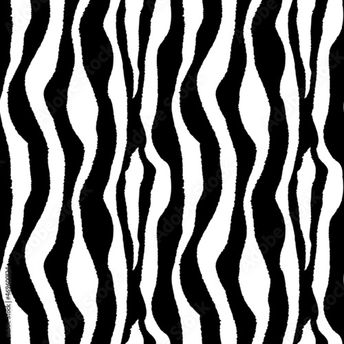 Seamless pattern of Abstract black and white stripes. Tiger or zebra skin texture. Print for fabric, wall wallpaper or wrapping paper. Natural ornament.