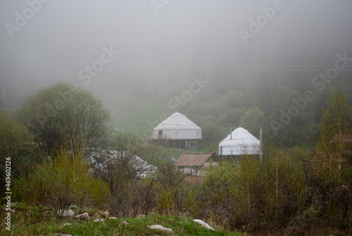 Yurts in rain and fog in a beautiful mountain setting in Almaty  Kazakhstan