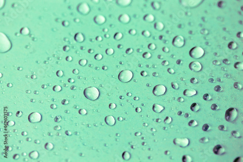 Small oxygen bubbles under water. Clear transparent liquid rain drops background