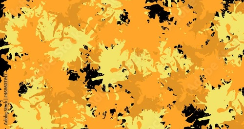 Animation of yellow and orange splashes of paint on black background photo