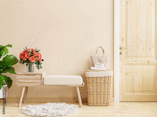 Door storage bench with cream colored wall.