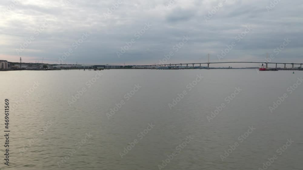 Silhouette of long cable-stayed bridge in distance Silhouette of long cable-stayed bridge in distance