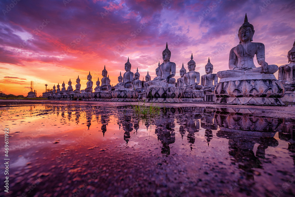 Many Statue buddha image at sunset in southen of Thailand