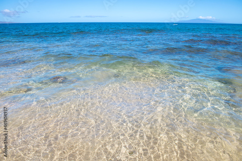 Tropical blue ocean in Hawaii. Summer sea in clean and clear water from surface for background. Waves concept design.