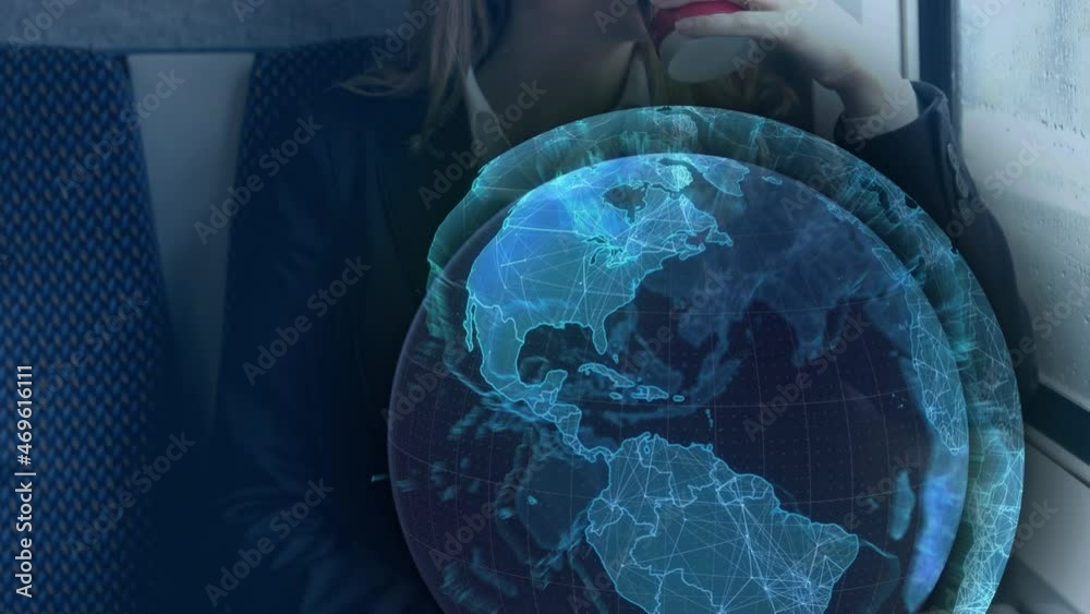 Animation of blue globe processing data, over businesswoman on train using smartphone Animation of blue globe processing data, over businesswoman on train using smartphone