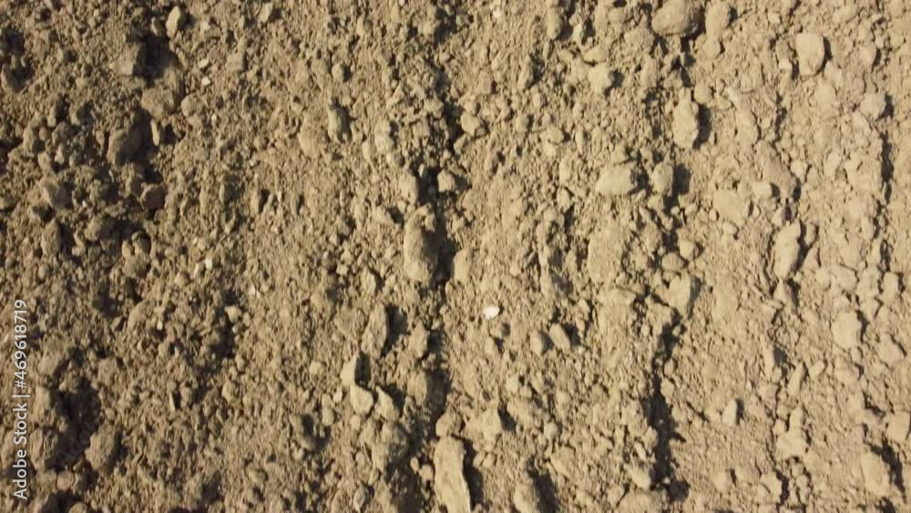 Plowed ground soil for agriculture cultivation rural field aerial view Plowed ground soil for agriculture cultivation rural field aerial view
