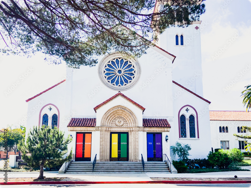 "God's Doors Are Open To All" Sign displayed on the doors of church