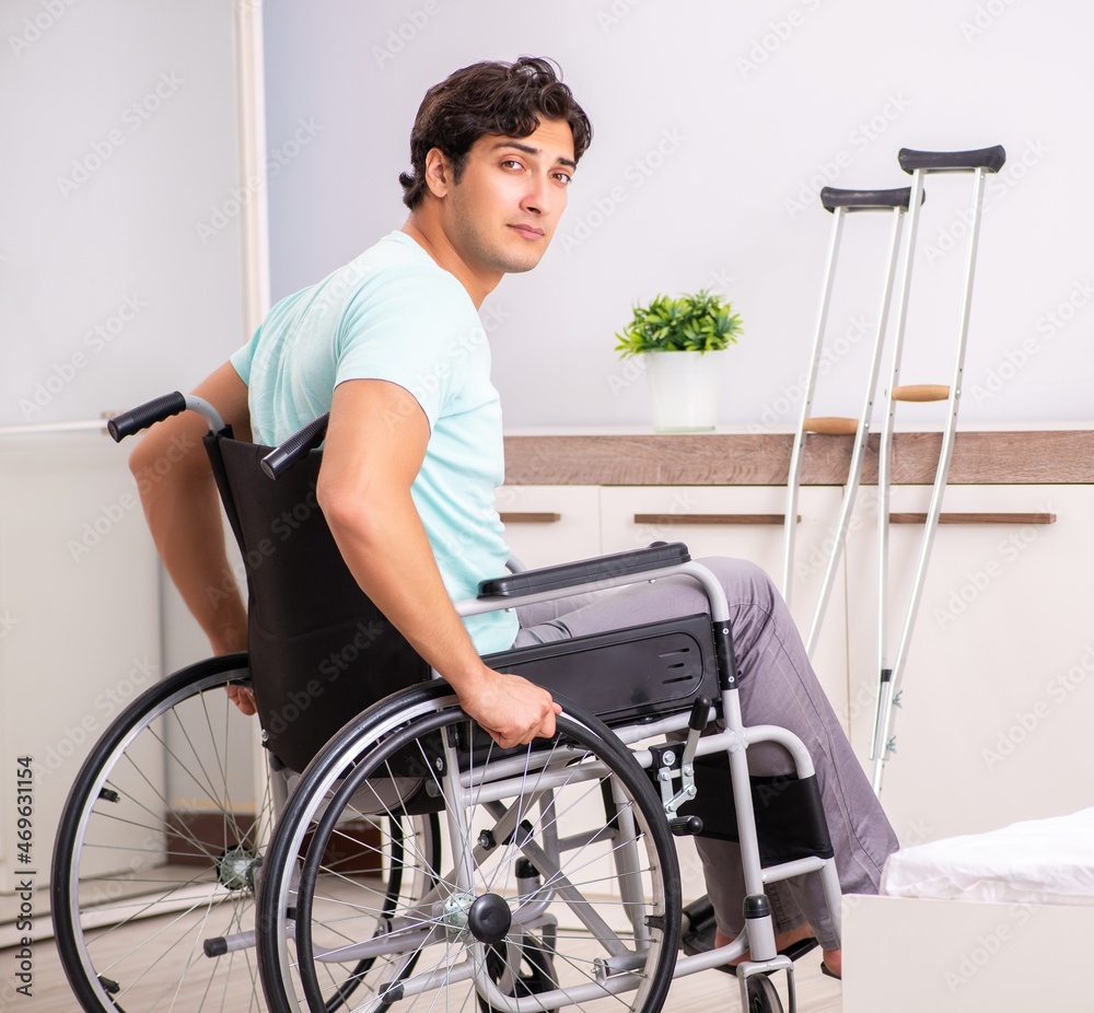 Young handsome disabled man recovering at home Young handsome disabled man recovering at home
