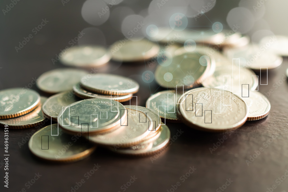 Stack coin with Graph sybols, candlestick chart stock market and bokeh background. planing earn cash investment from trade forex and saving money future for 2022 new year. finance and business. Stack coin with Graph sybols, candlestick chart stock market and bokeh background. planing earn cash investment from trade forex and saving money future for 2022 new year. finance and business.