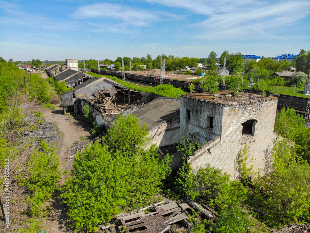 Aerial view of destroyed warehouses near the railway (Orichi, Kirov region, Russia)