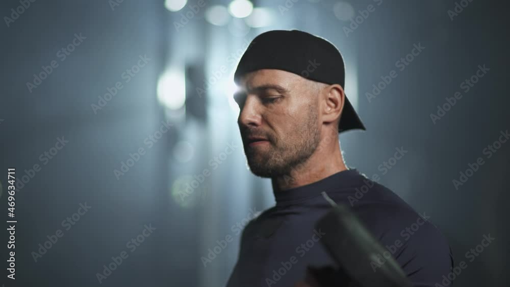 Fortitude, disabled athlete in wheelchair performs exercises with dumbbells, gym training. Fortitude, disabled athlete in wheelchair performs exercises with dumbbells, gym training.