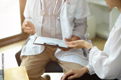 Wallpaper Mural Cropped image of A doctor and a patient discuss treatment options Torontodigital.ca