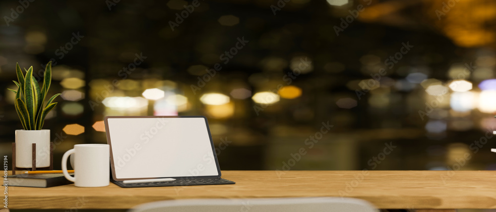 Working desk with tablet mockup and copy space on wooden tabletop. Working desk with tablet mockup and copy space on wooden tabletop.