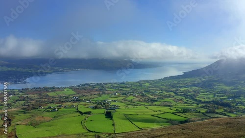 Carlingford Lough, Louth, Ireland, October 2021. Drone pulls east towards the Tain Way away from Bavan and Omeath while touching the low-hanging clouds. photo