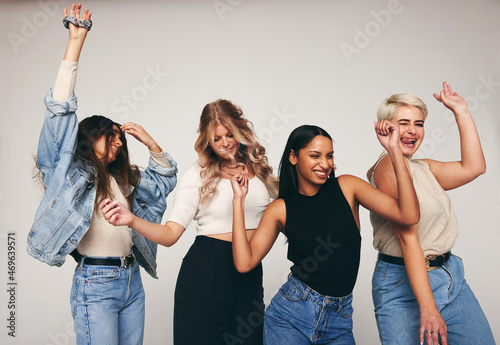 Group of female friends dancing in a studio