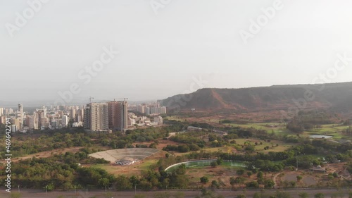 A Aerial drone shot of the city surrounded green cover, Navi Mumbai, India photo