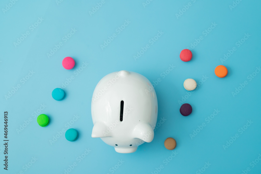 top view pig piggy bank with colorful candies b blue background
top view pig piggy bank with colorful candies b blue background