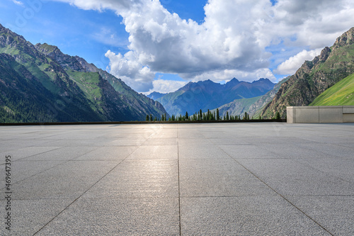 Empty square floor and green mountain background. © ABCDstock