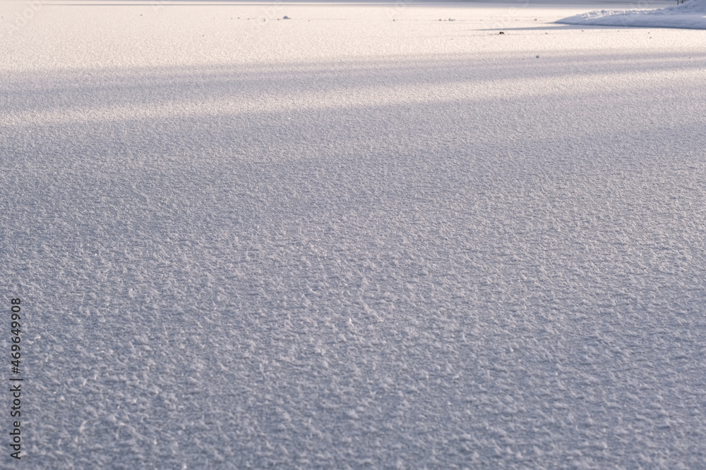 Texture of ice of frozen lake in sunlight Texture of ice of frozen lake in sunlight