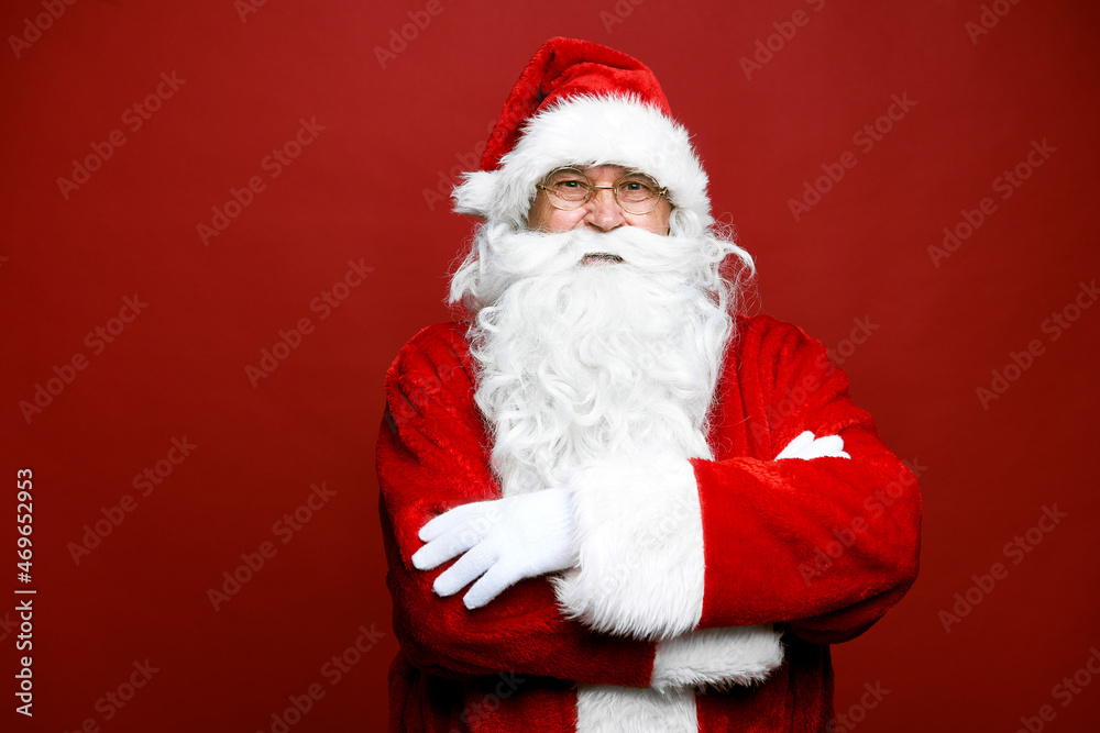 Portrait of smiling caucasian Santa Claus on red background Portrait of smiling caucasian Santa Claus on red background