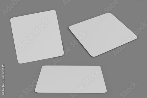 Blank white mouse-pad mockup isolated over gray background. Front and side view of mat mouse pad. 3d rendering. photo