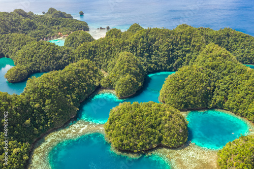 Fototapeta Naklejka Na Ścianę i Meble -  Tropical forest covered limestone around clear blue lagoons. Drone view of famous beautiful destination in Socorro Philippines, Sohoton Cove in Bucas Grande, Siargao. Best places in asia.