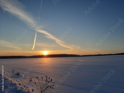Winter landscape. Beautiful winter sunset. Sunset with beautiful clouds. Gorgeous sunset.